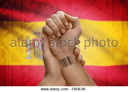 Barcode ID number tattoo on wrist of dark skinned person and national flag on background - Peru ...