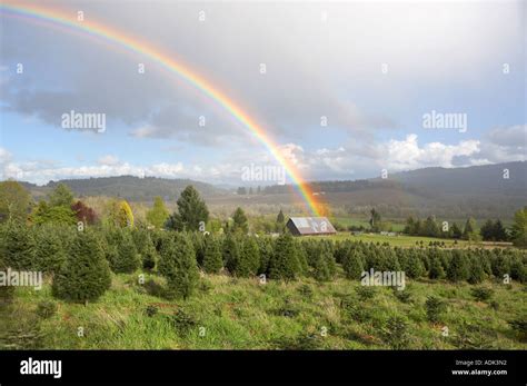 Thunderstorm clouds with rainbow and barn over Monroe Oregon Stock ...