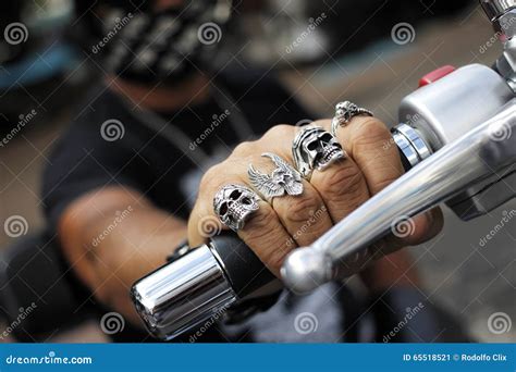 Rings on Fingers Holding Motorcycle Stock Image - Image of silver, hold: 65518521