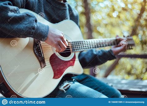 Playing an Acoustic Guitar in Nature, Independent Style Stock Image ...