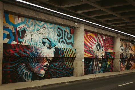 white concrete wall with multicolored graffiti art photo – Free Graffiti Image on Unsplash