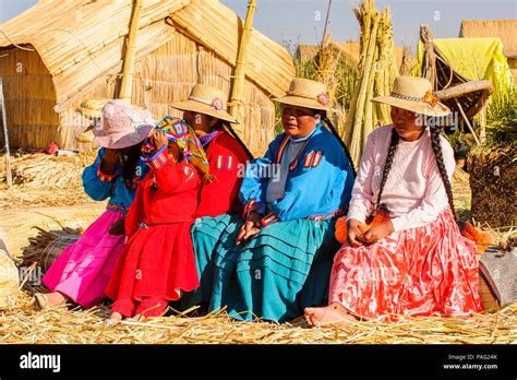 PUNO, PERU - NOVEMBER 7, 2010: Unidentified Uros people in traditional ...