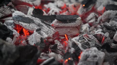 Premium Photo | Metal grill with coals grilled meat the fire is ...