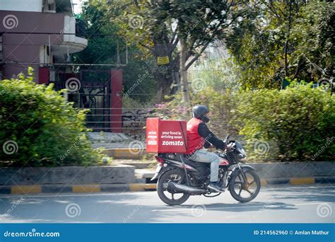 Zomato Delivery Boy with Red Hot Box for Food on a Bike Zooming at High Speed To Deliver Orders ...