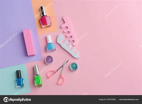 Nail lacquers and manicurist tools — Stock Photo © YGphoto #208725500