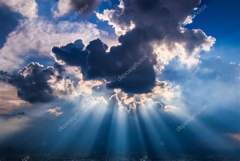 Rays of light shining through dark clouds — Stock Photo © Deerphoto #37148885