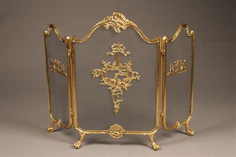 Antique solid brass folding fireplace screen with nice castings.