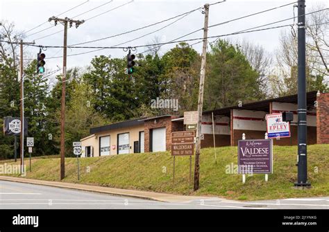 VALDESE, NC, USA-24 MARCH 2022: Street signs noting the entrance to Valdese and various points ...