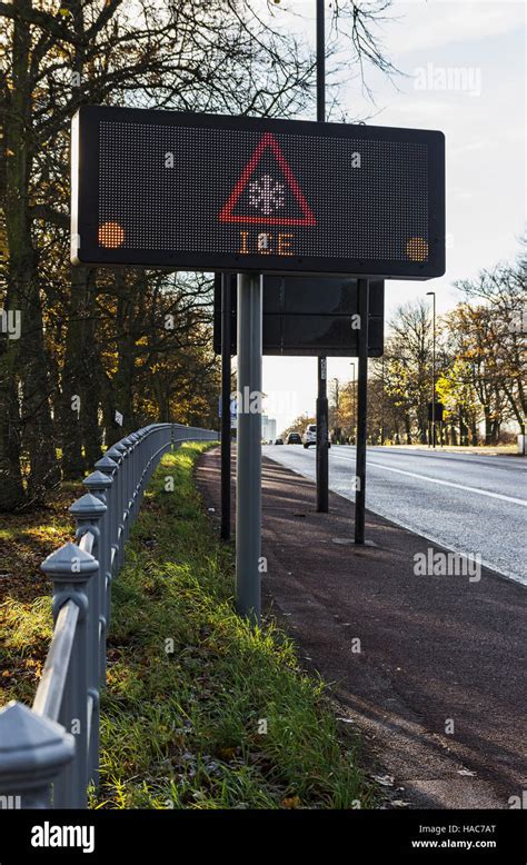 Road sign warning of ice on a UK road Stock Photo - Alamy