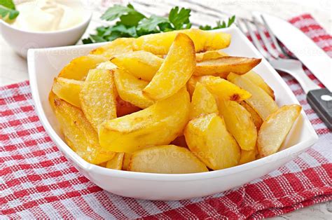 quartiers de pommes de terre frites 7206253 Photo de stock chez Vecteezy