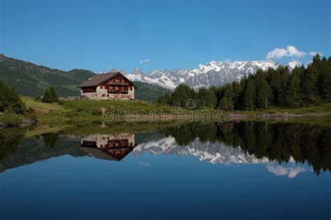 House and Mountain Lake Landscape Stock Image - Image of holiday, house ...