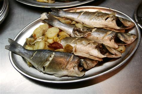 Baked Sea Bass With Potatoes, Tomatoes and Onions Recipe - NYT Cooking