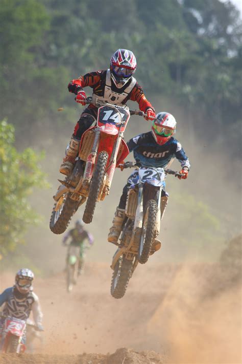 Two People Riding on Dirt Bike · Free Stock Photo