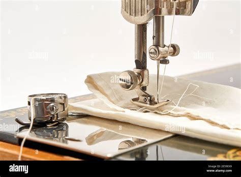 Sewing machine and parts on a white background Stock Photo - Alamy