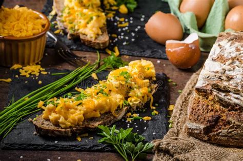 Scrambled eggs with herbs stock photo. Image of bread - 73470128