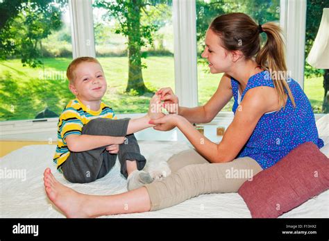 two children tickling feet Stock Photo - Alamy