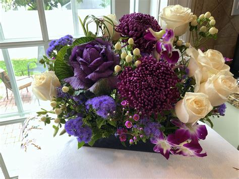 Delicate orchids are placed into this textured arrangement w purple ...