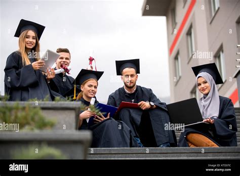 Young people graduating, celebration Stock Photo - Alamy