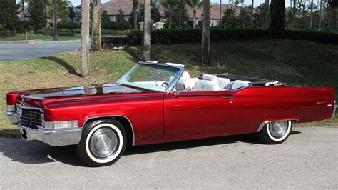 red cadillac car convertible - Melodee Connell