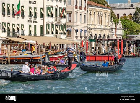 Tourists taking gondola rides on The Grand Canal near St Mark's Square ,Venice, Italy Stock ...