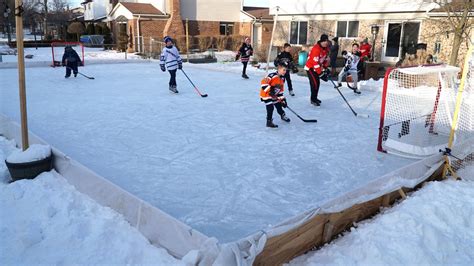 Fun at a backyard hockey rink in Canton