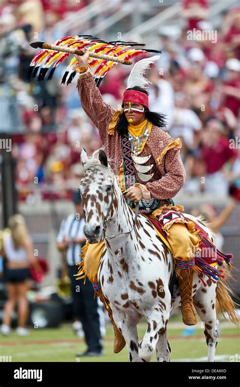 September 14, 2013: Florida State Seminoles mascot Chief Osceola celebrates after a FSU ...