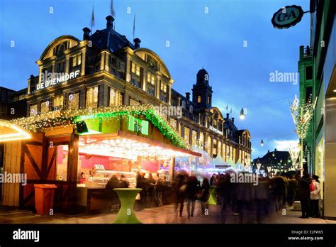 Netherlands Amsterdam Damrak avenue Christmas markets and Bijenkorf ...