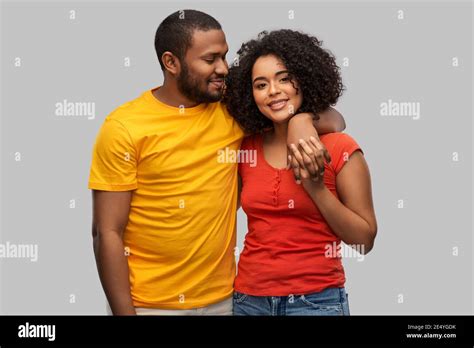 happy african american couple hugging Stock Photo - Alamy