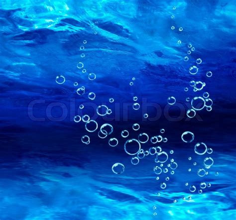 Blue bubbles rising deep underwater ... | Stock image | Colourbox