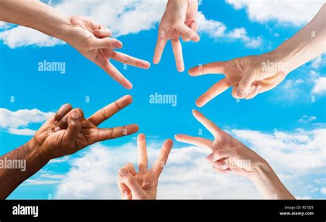 Hands Showing The Peace Sign In Circle Stock Photo - Alamy