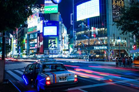 the evening falls on a dimly lit street in tokyos shibuya district, zen ...