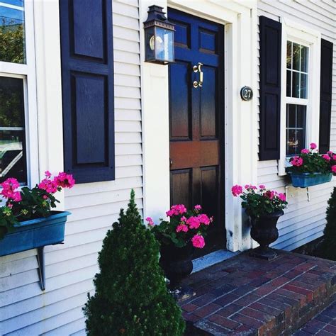 Omg this house is so cute! The black shutters make the white pop and so ...