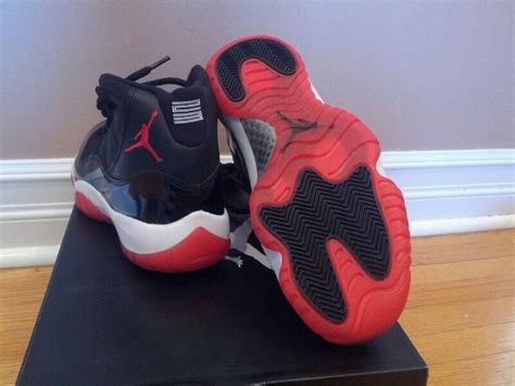 Air Jordan Bred 11s (Black/Red 11s) / SneakerVault