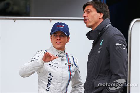 (L to R): Susie Wolff, Williams Development Driver with husband Toto Wolff, Mercedes AMG F1 ...