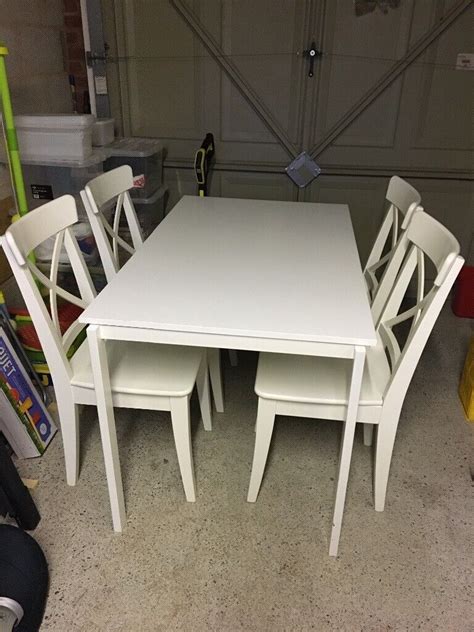 IKEA white dining table and four chairs | in Paignton, Devon | Gumtree
