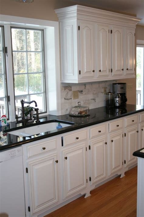 White Kitchens with Black Countertops | White cabinets black ...