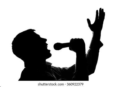 Young Man Singing Into Microphone Raising Stock Photo 360922379 ...