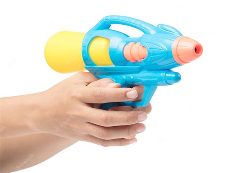 Premium Photo | Gun water toy on hand isolated on a white background