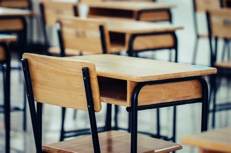 Premium Photo | Empty school classroom with desks chair wood