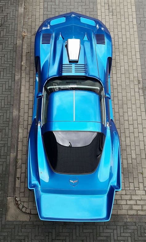an overhead view of a blue sports car