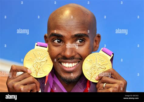 Great Britain's Mo Farah with his 2 Olympic gold medals he won in the Men's 10,000, and 5000m ...