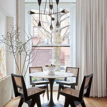 Black Tulip Chairs at Saarinen Oval Table - Transitional - Dining Room