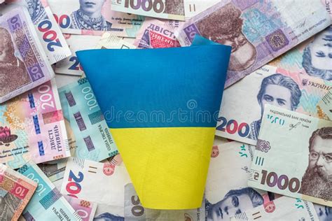 Ukrainian Hryvnia Banknotes on the National Flag of Ukraine. Stock Photo - Image of closeup ...