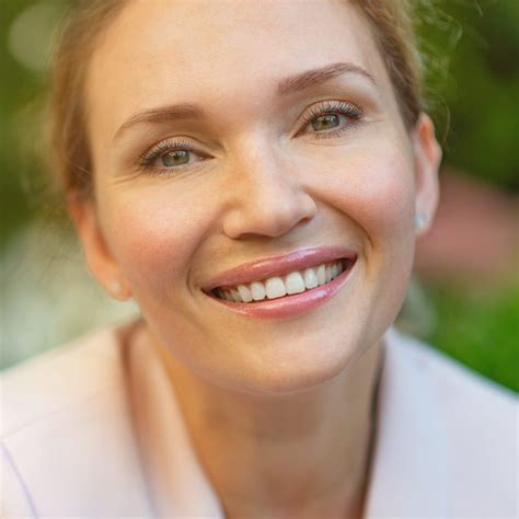 Close-up portrait of a smiling woman on the street. Happy woman's face closeup, outdoors. Happy ...