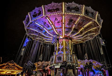 Royalty-Free photo: Swing carnival ride with lights turned-on | PickPik