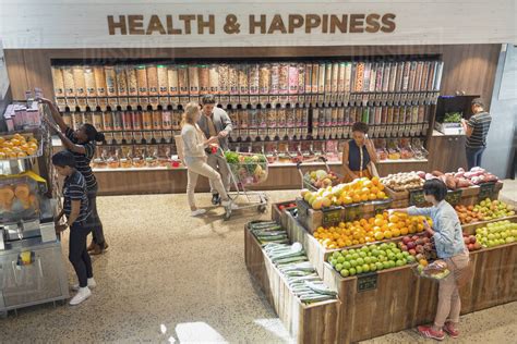 View of people grocery shopping in health food store - Stock Photo ...