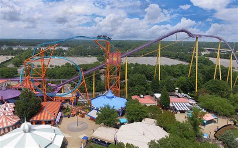 an aerial view of a roller coaster and other rides at a theme park or amusement park