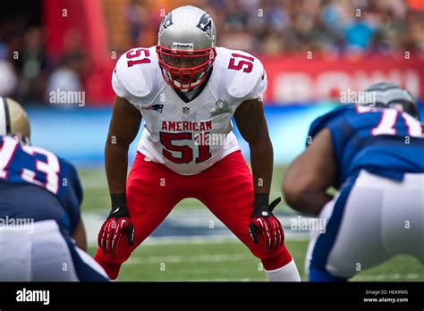 New England Patriots linebacker, Jerod Mayo, looks over the offense ...