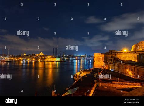 The Grand Harbour in Malta at night, view from Valletta city to Senglea ...