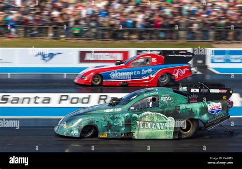 Top Fuel Funny Car drag racing at Santa Pod raceway. Steve Ashdown Dodge Stratus nearside v ...